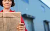 woman reading stock market from a newspaper