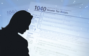 silhouette of a woman with a 1040 tax form in the background