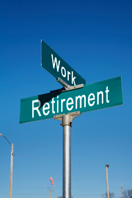 street sign reading the cross roads of work and retirement