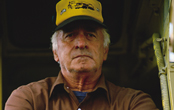 elderly man operating machinery