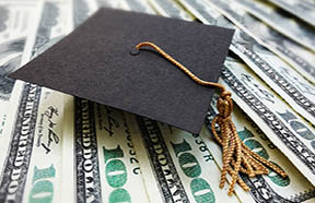 mortarboard with money