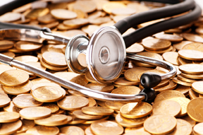 a stethoscope on a bed of coins