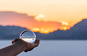 person holding crystal ball